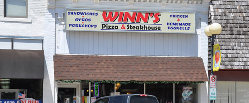 The Winn's Pizza & Steakhouse storefront on the north side of the Indianola square.